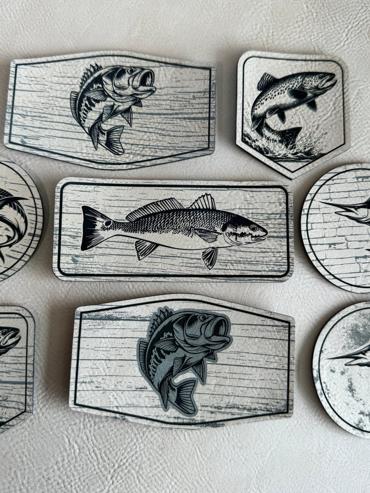 Assorted engraved leatherette fishing patches with fish designs