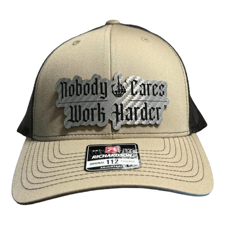Nobody Cares/Work Harder Acrylic Patch design shown on a trucker hat